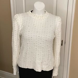 White pearled sweater